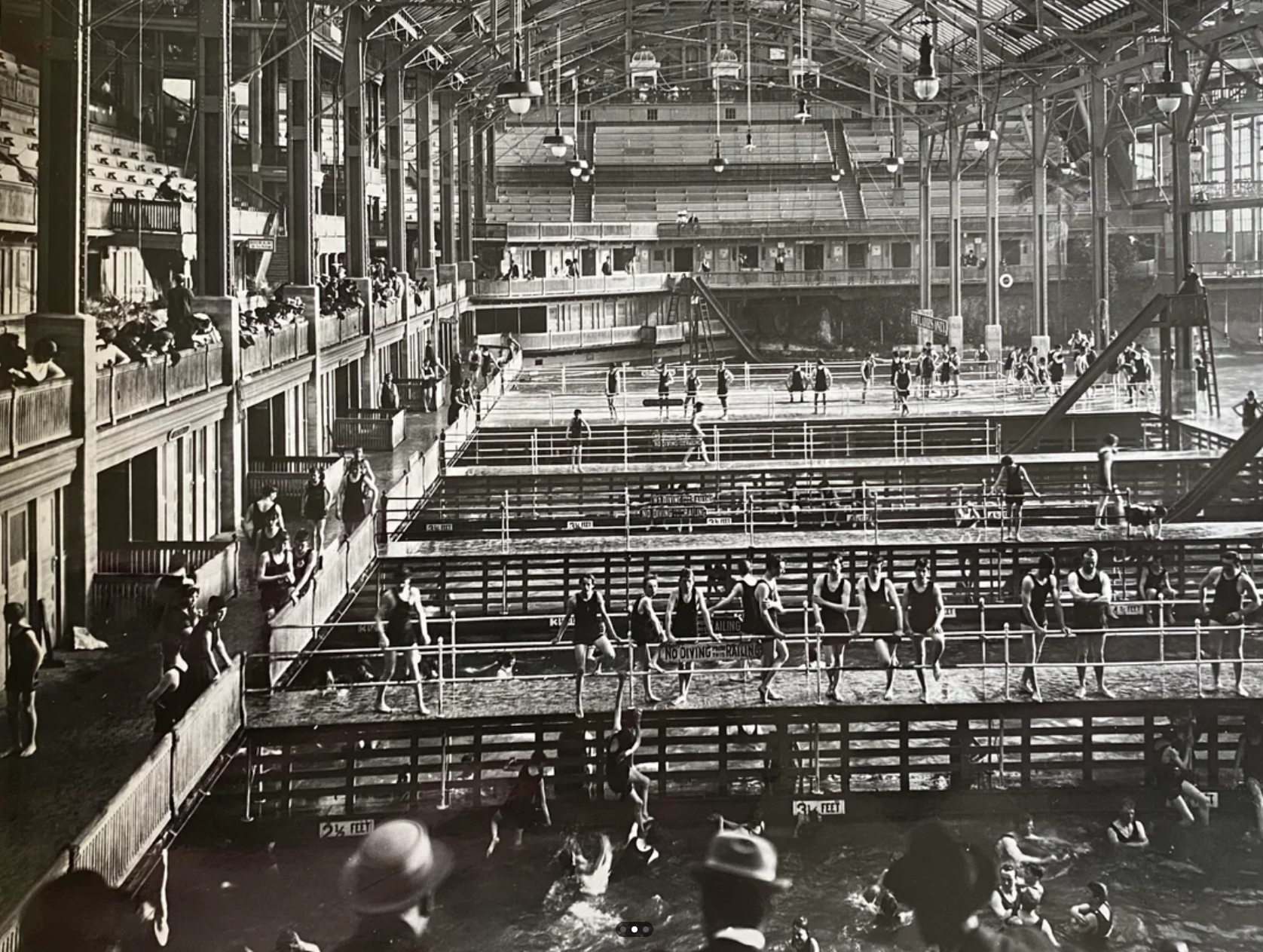 Historic photograph of Sutro Baths showing tiered pools, walkways, and spectator seating